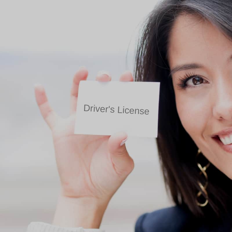 Women holding driver's license